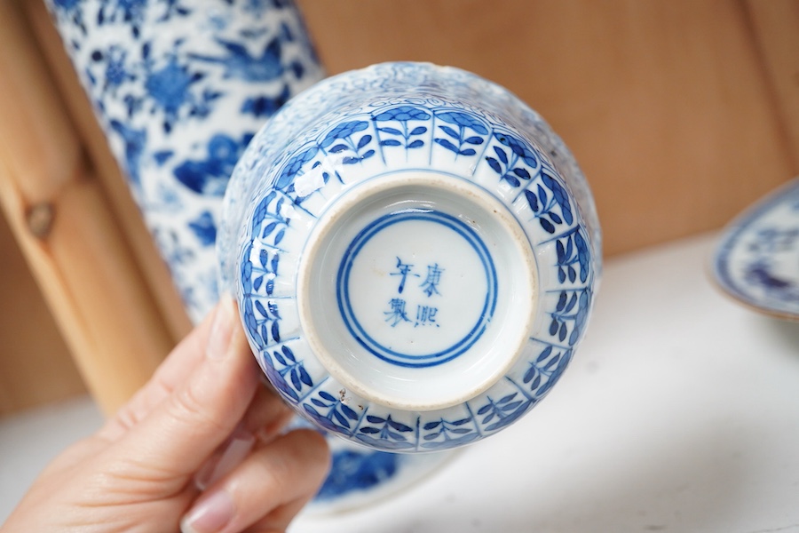 An early 20th century Chinese blue and white sleeve vase, 18th century plate and bowl, tallest 24.5cm